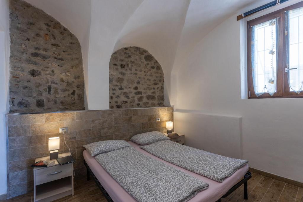 A bed or beds in a room at Lancillotto