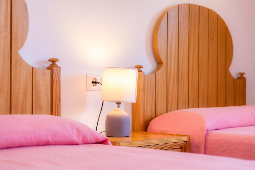 A bed or beds in a room at Margarita