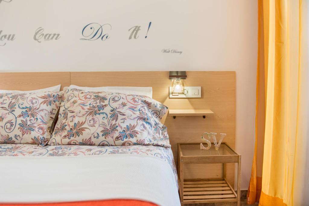 Postel nebo postele na pokoji v ubytování Suite Victoria Excellent
