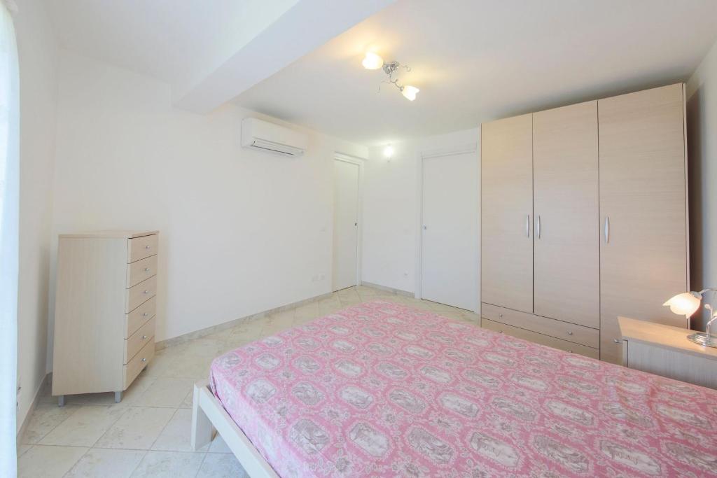 Postel nebo postele na pokoji v ubytování Villa Belvedere Nisporto