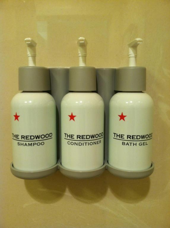 a group of three bottles of detergent on a shelf at The Redwood Riverwalk, a boutique hotel in Fortuna