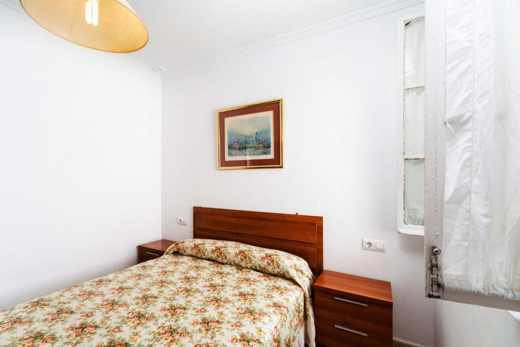 A bed or beds in a room at Luminoso apartamento en Cadiz