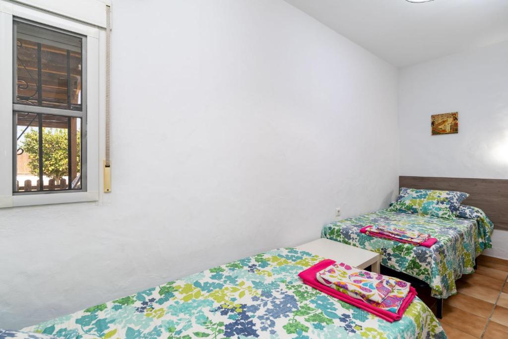 Postel nebo postele na pokoji v ubytování Casa Carlos con Piscina Privada en Conil