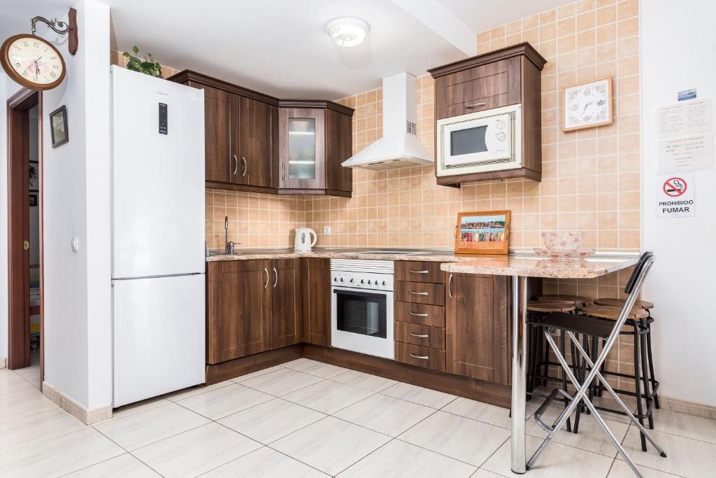 Kuchyň nebo kuchyňský kout v ubytování Apartamento el Carmen