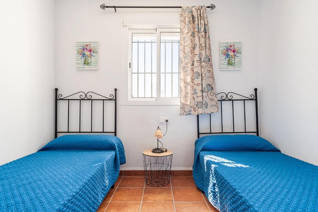 Posteľ alebo postele v izbe v ubytovaní Casa Marquez - Sólo Familias