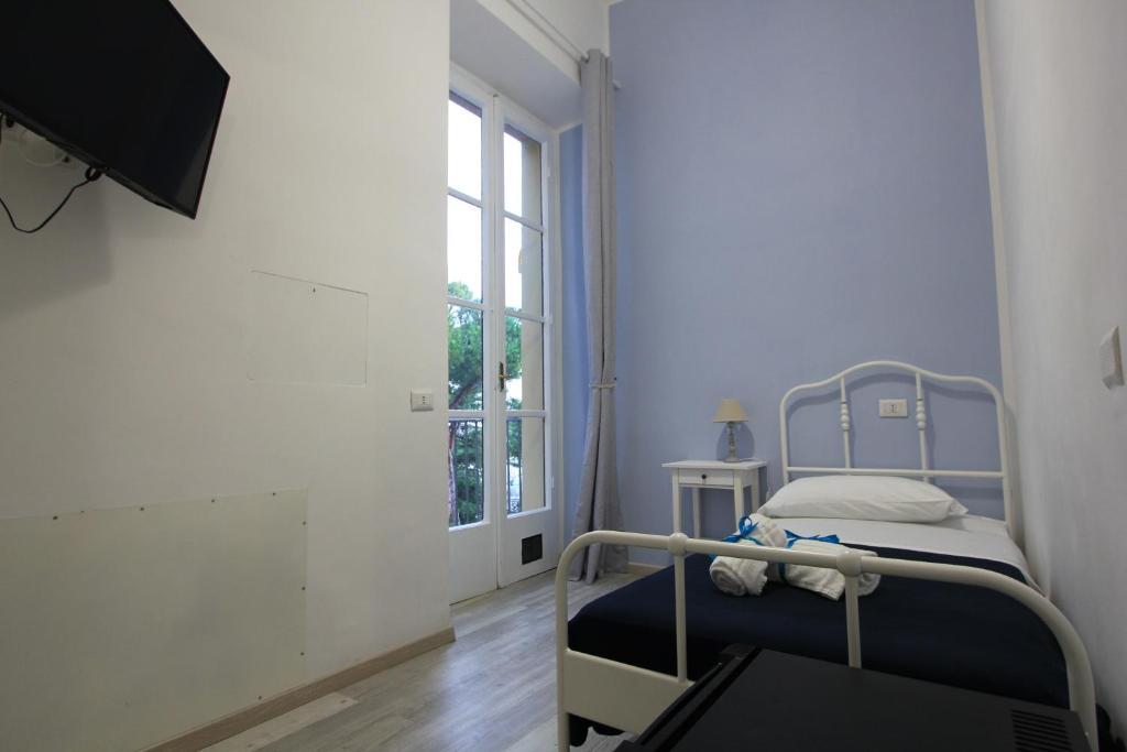 Postel nebo postele na pokoji v ubytování B&B Vitruvio Suites