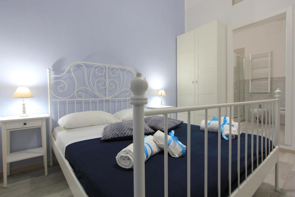 Postel nebo postele na pokoji v ubytování B&B Vitruvio Suites