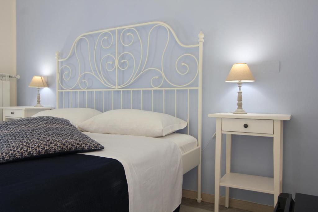Postel nebo postele na pokoji v ubytování B&B Vitruvio Suites