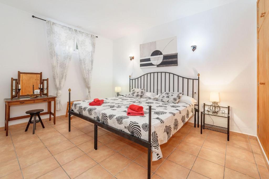 Postel nebo postele na pokoji v ubytování La Casita