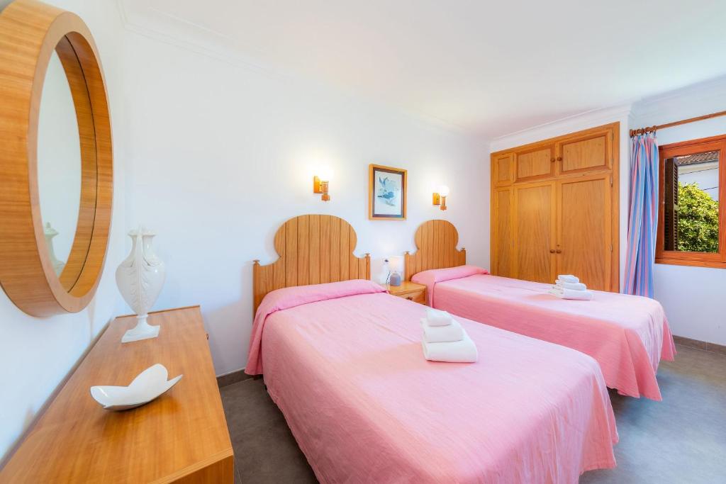 A bed or beds in a room at Margarita