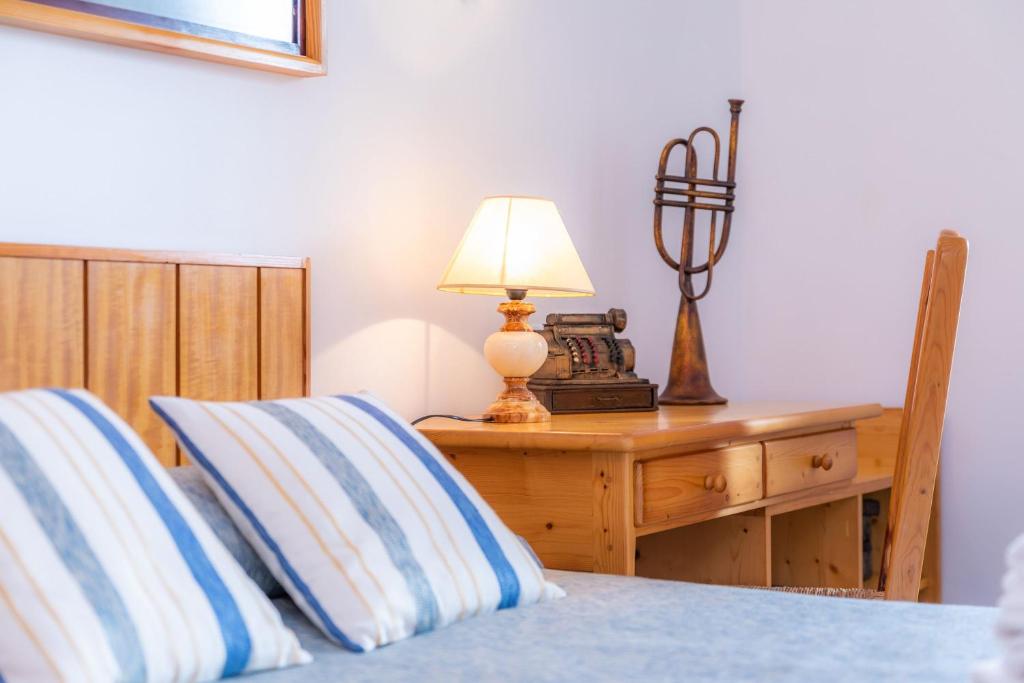 A bed or beds in a room at Margarita