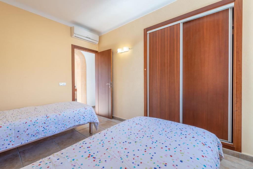Postel nebo postele na pokoji v ubytování Caril