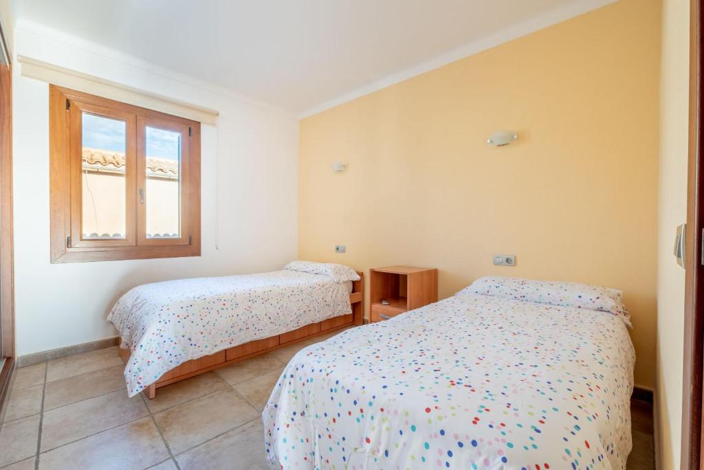 Postel nebo postele na pokoji v ubytování Caril