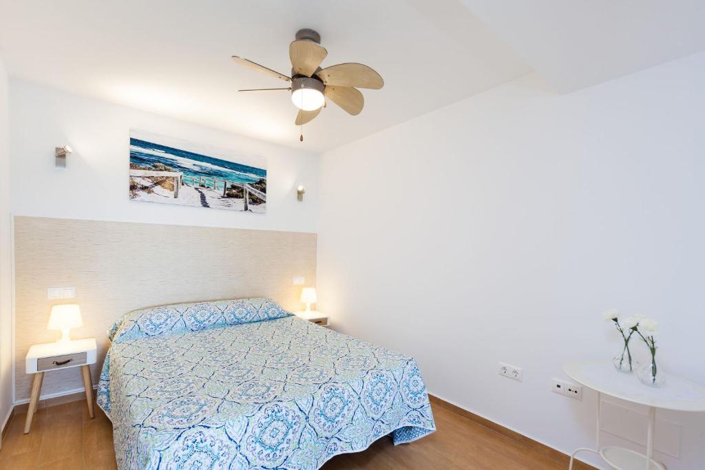 Posteľ alebo postele v izbe v ubytovaní Apartamento Prado