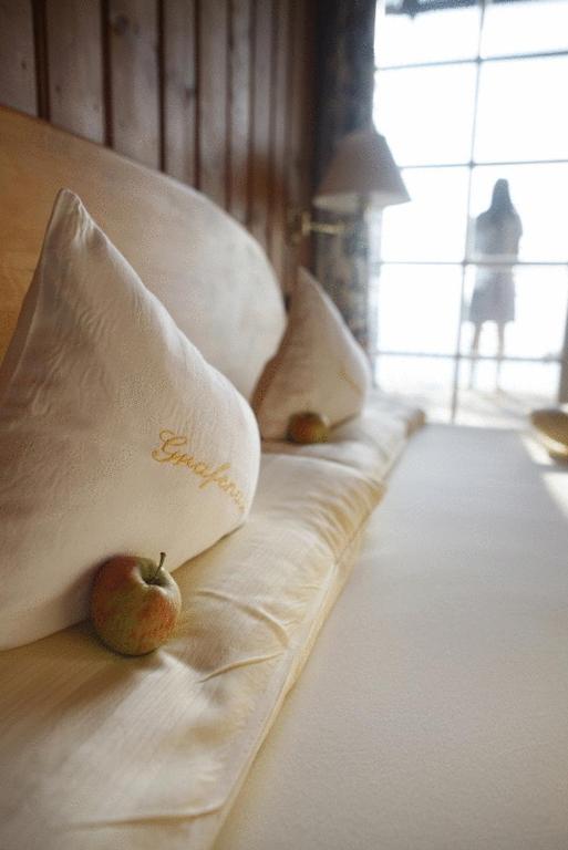 Postel nebo postele na pokoji v ubytování Biohotel Grafenast