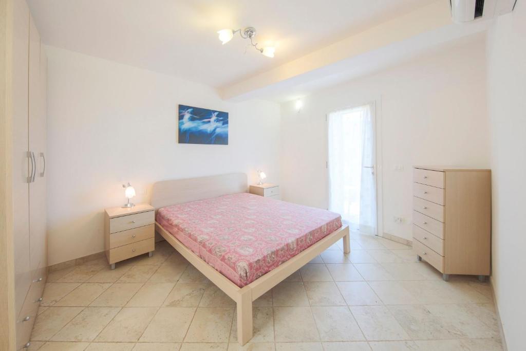 Postel nebo postele na pokoji v ubytování Villa Belvedere Nisporto
