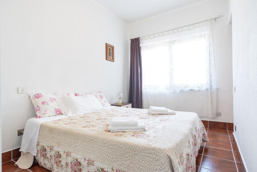 מיטה או מיטות בחדר ב-Casa Giovanna