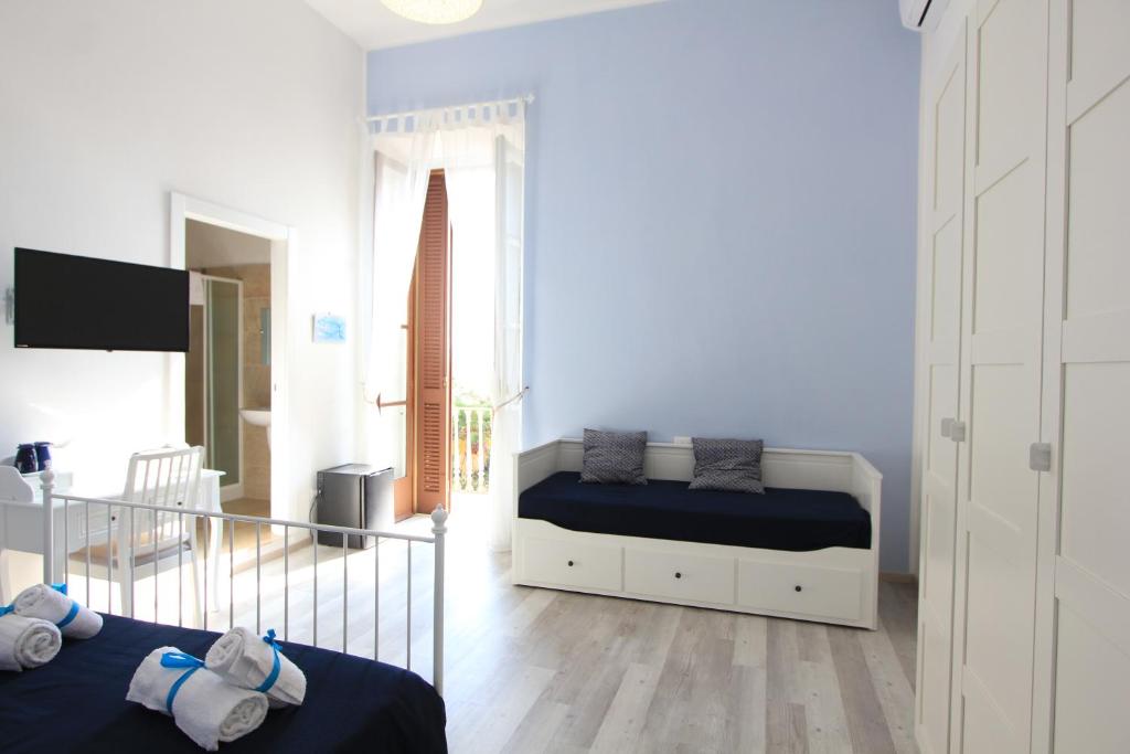 Postel nebo postele na pokoji v ubytování B&B Vitruvio Suites