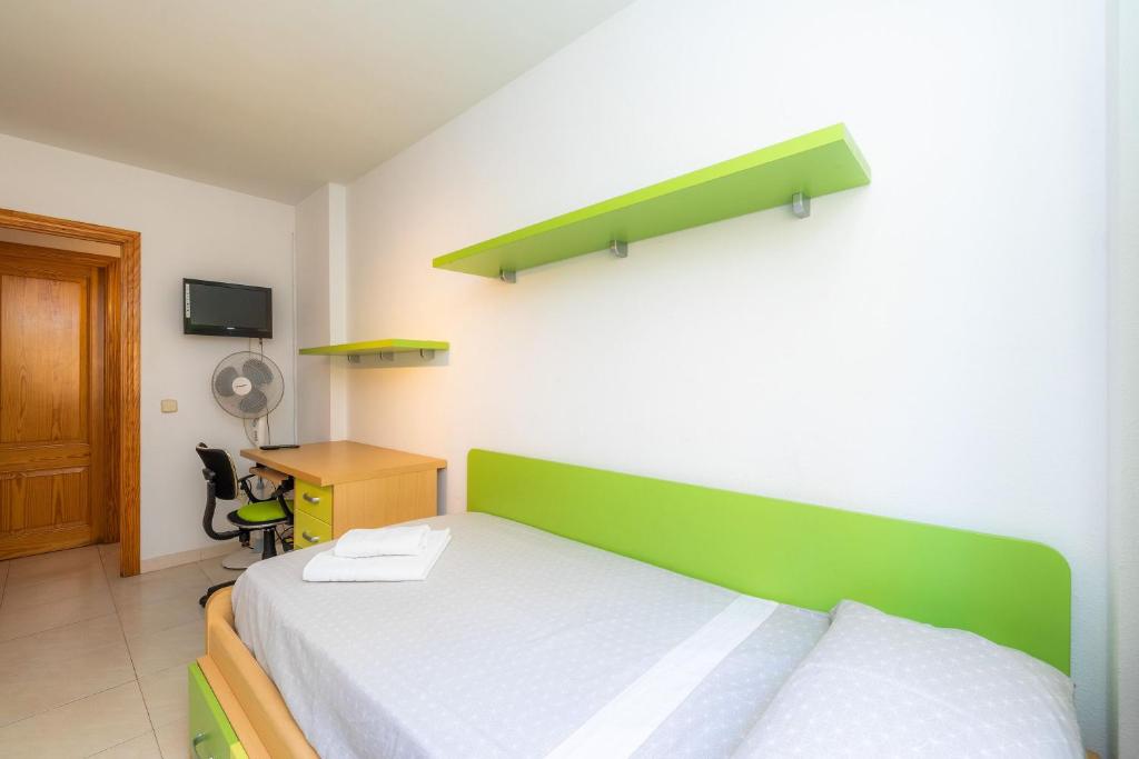 A bed or beds in a room at Marbi