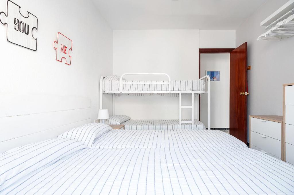 Łóżko lub łóżka w pokoju w obiekcie Casa Poniente