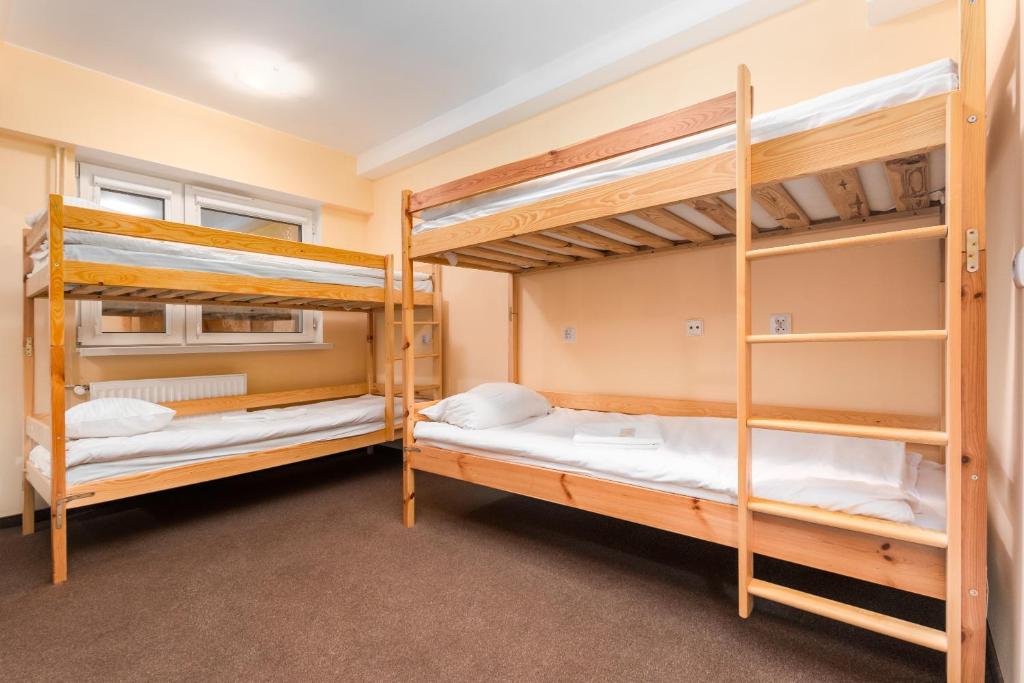 Postel nebo postele na pokoji v ubytování Luxhostel24 Warsaw