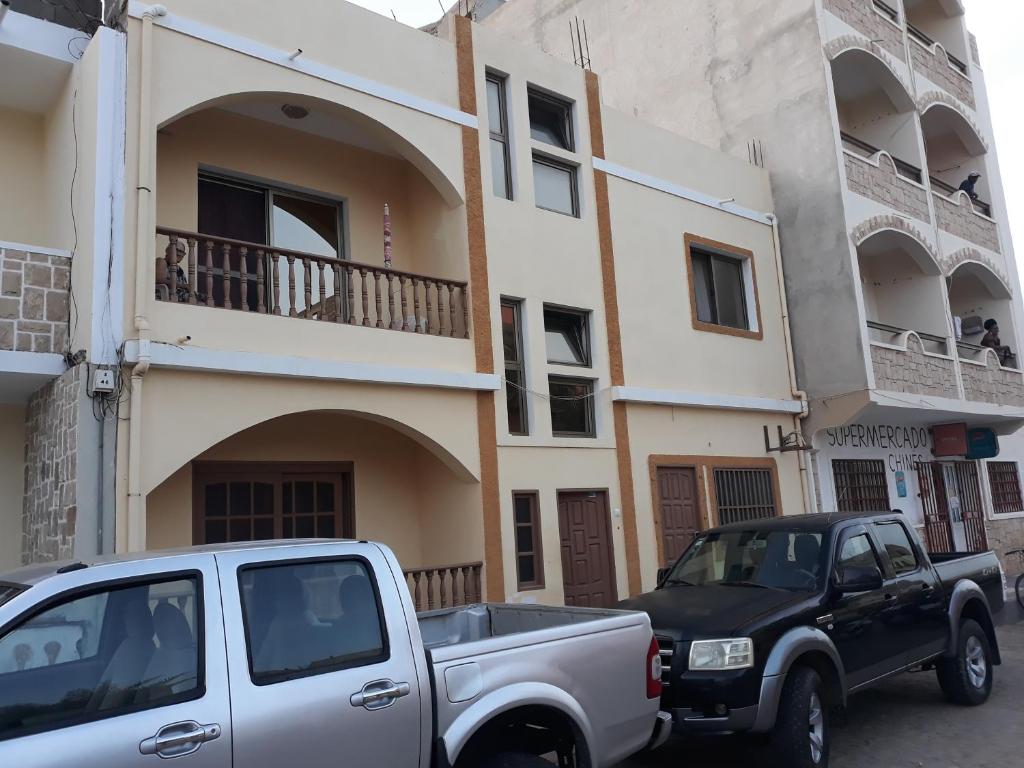 a white truck parked in front of a building at ka-Bela in Sal Rei