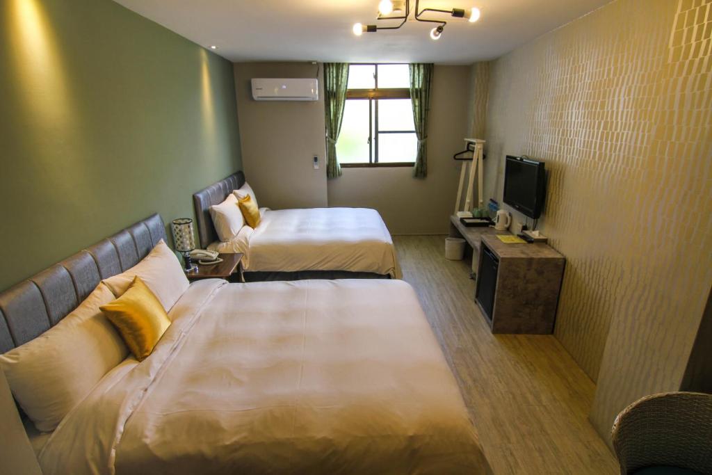 Postel nebo postele na pokoji v ubytování Sun Moon Lake Loft Inn