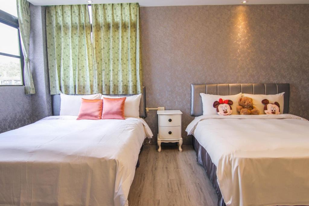 Postel nebo postele na pokoji v ubytování Sun Moon Lake Loft Inn