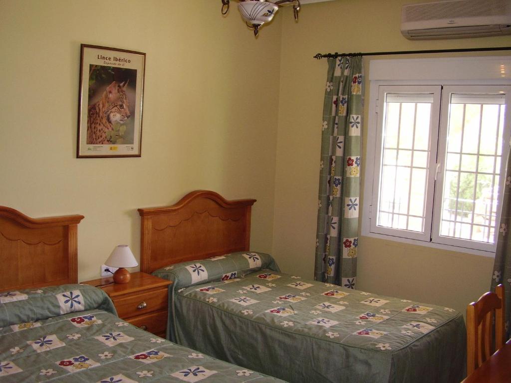 Postel nebo postele na pokoji v ubytování Casa Rural ¨La Noria Olaya¨