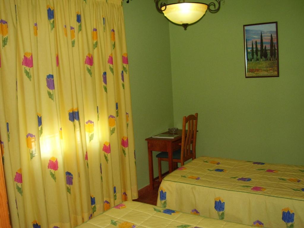 Postel nebo postele na pokoji v ubytování Casa Rural ¨La Noria Olaya¨