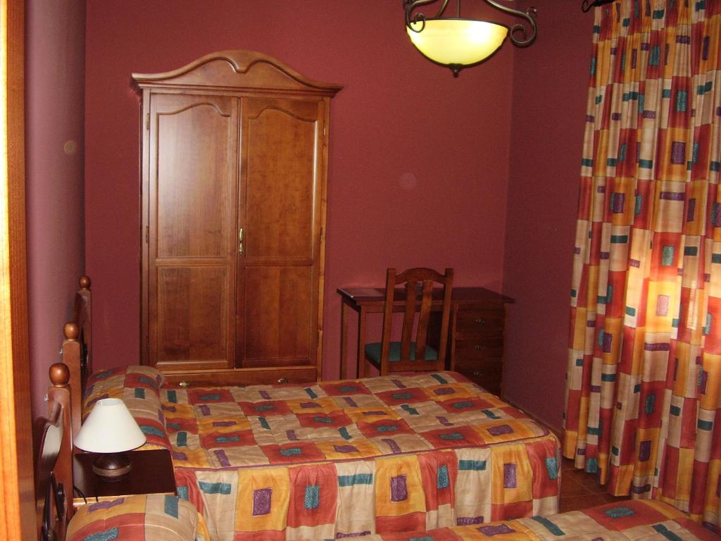 Postel nebo postele na pokoji v ubytování Casa Rural ¨La Noria Olaya¨