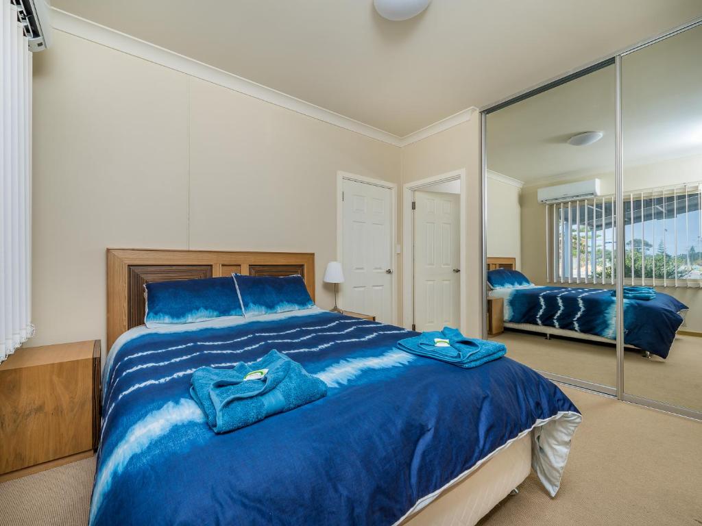 A bed or beds in a room at Seafront Unit 50