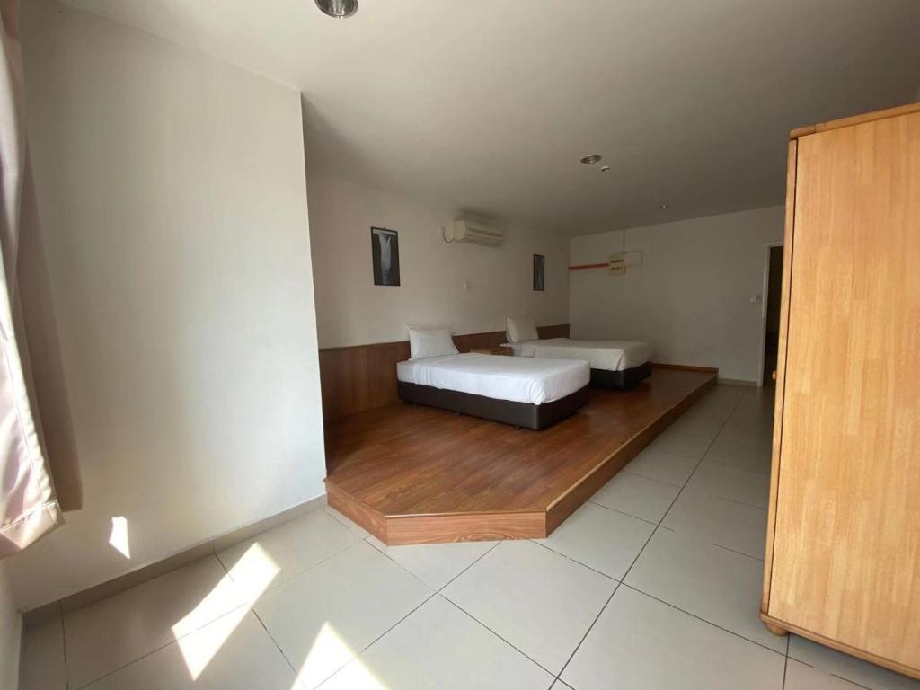 Postel nebo postele na pokoji v ubytování Swan Garden Hotel