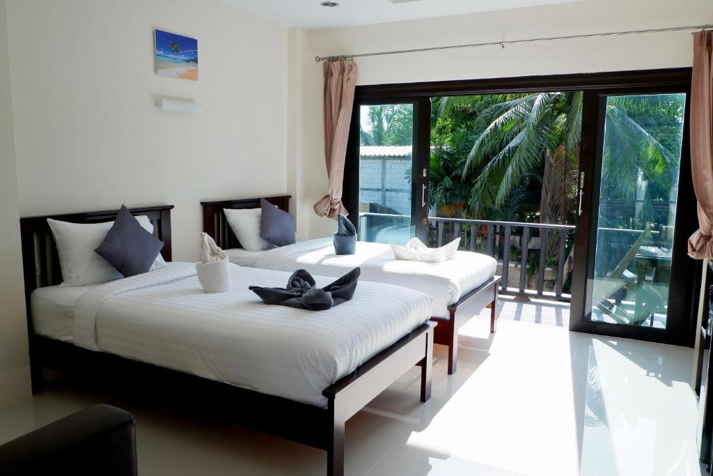 Postel nebo postele na pokoji v ubytování Aiya Resort Koh-Tao