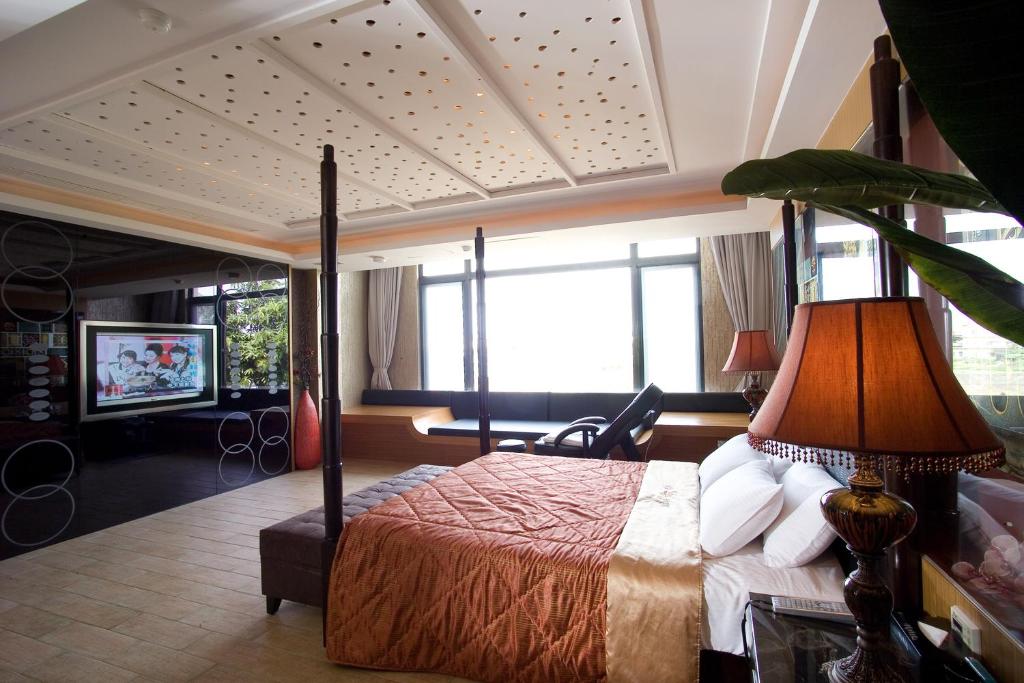 Postel nebo postele na pokoji v ubytování Chateau Motel & Spa