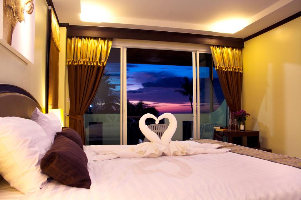 Postel nebo postele na pokoji v ubytování Baan Sailom Hotel Phuket - Sha Extra Plus