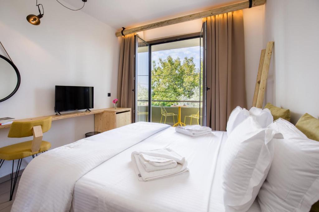Postel nebo postele na pokoji v ubytování Filippos Hotel