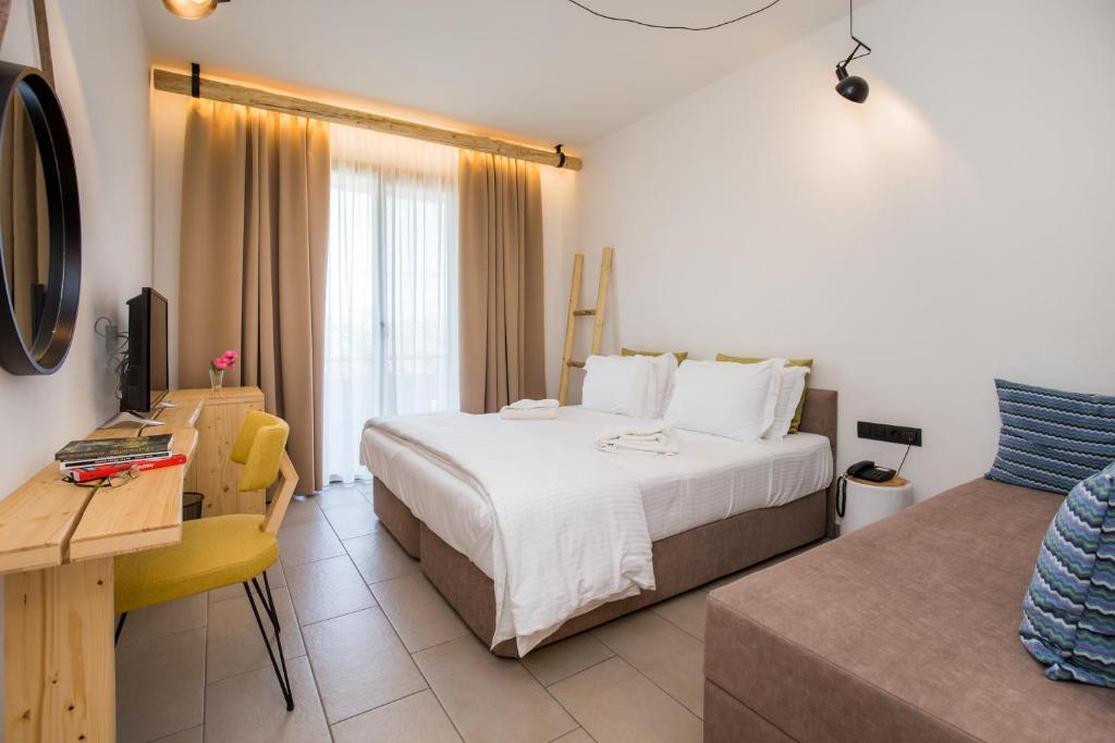 Postel nebo postele na pokoji v ubytování Filippos Hotel