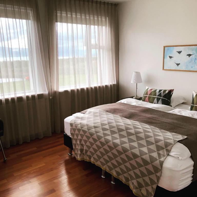 Postel nebo postele na pokoji v ubytování Apt. Hotel Hjalteyri