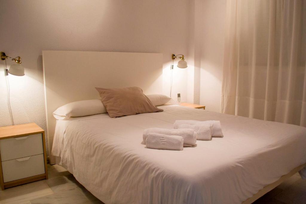 Posteľ alebo postele v izbe v ubytovaní Holidays Malaga
