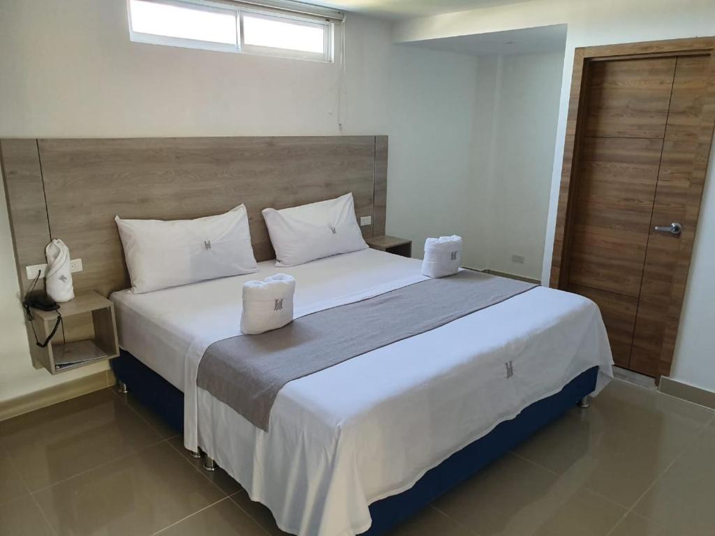 Cama o camas de una habitación en HOTEL A1 EXPRESS