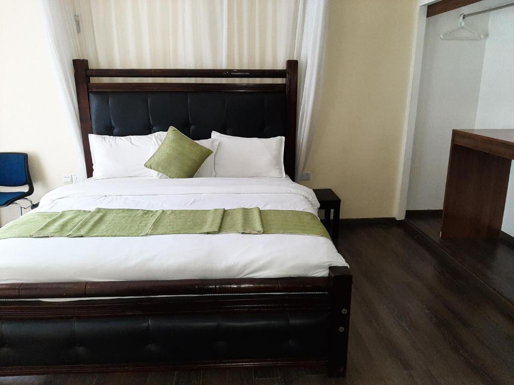 Postel nebo postele na pokoji v ubytování D2W Residency Suites