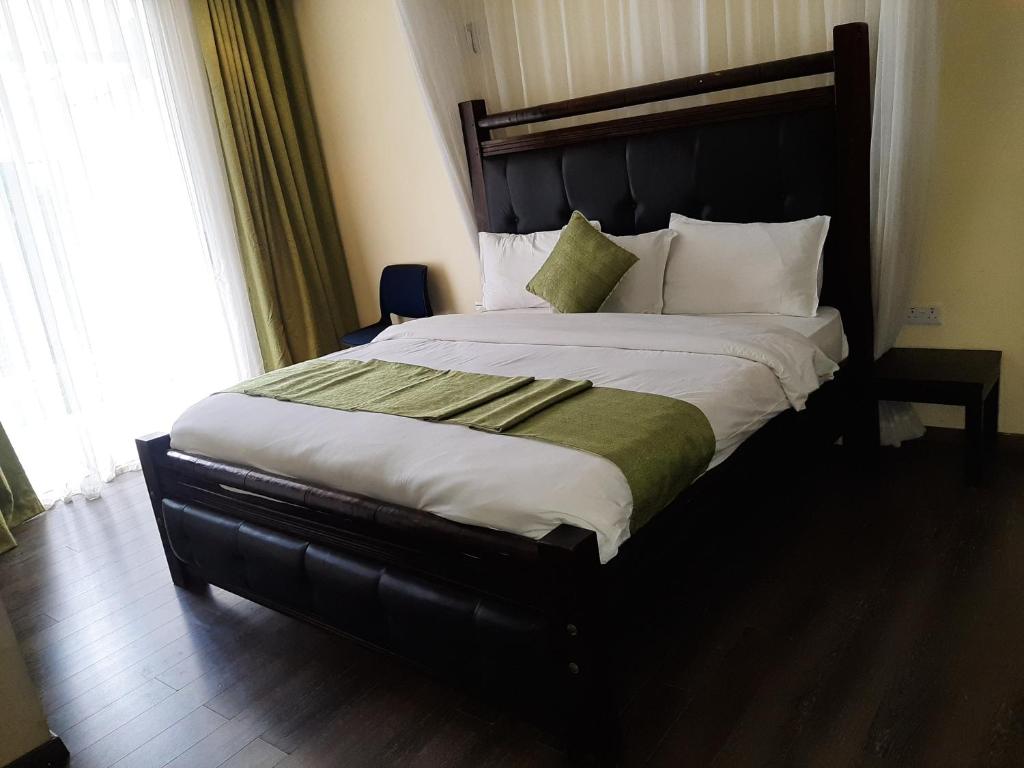 Postel nebo postele na pokoji v ubytování D2W Residency Suites