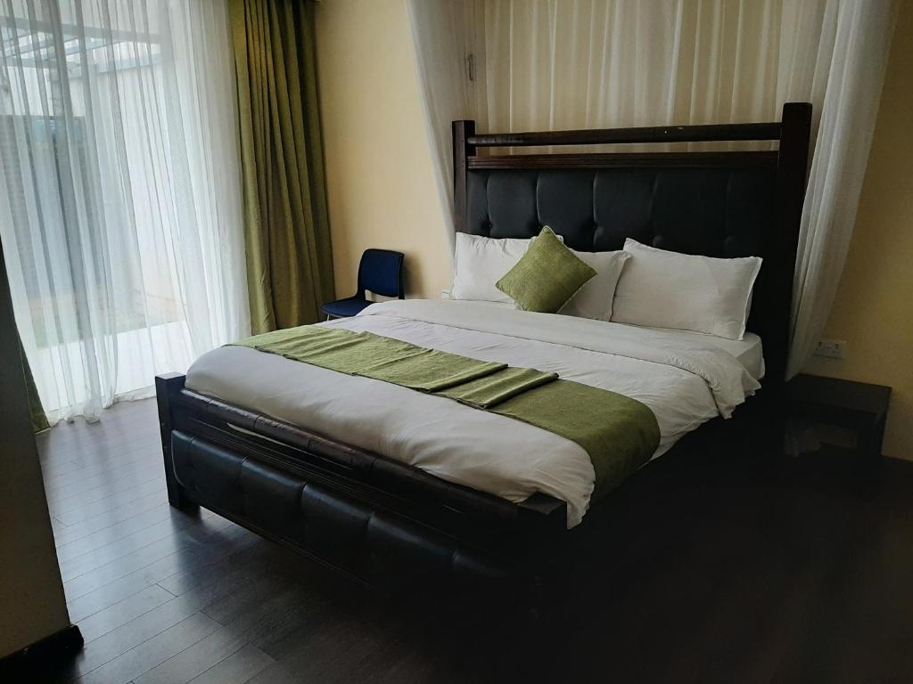 Postel nebo postele na pokoji v ubytování D2W Residency Suites