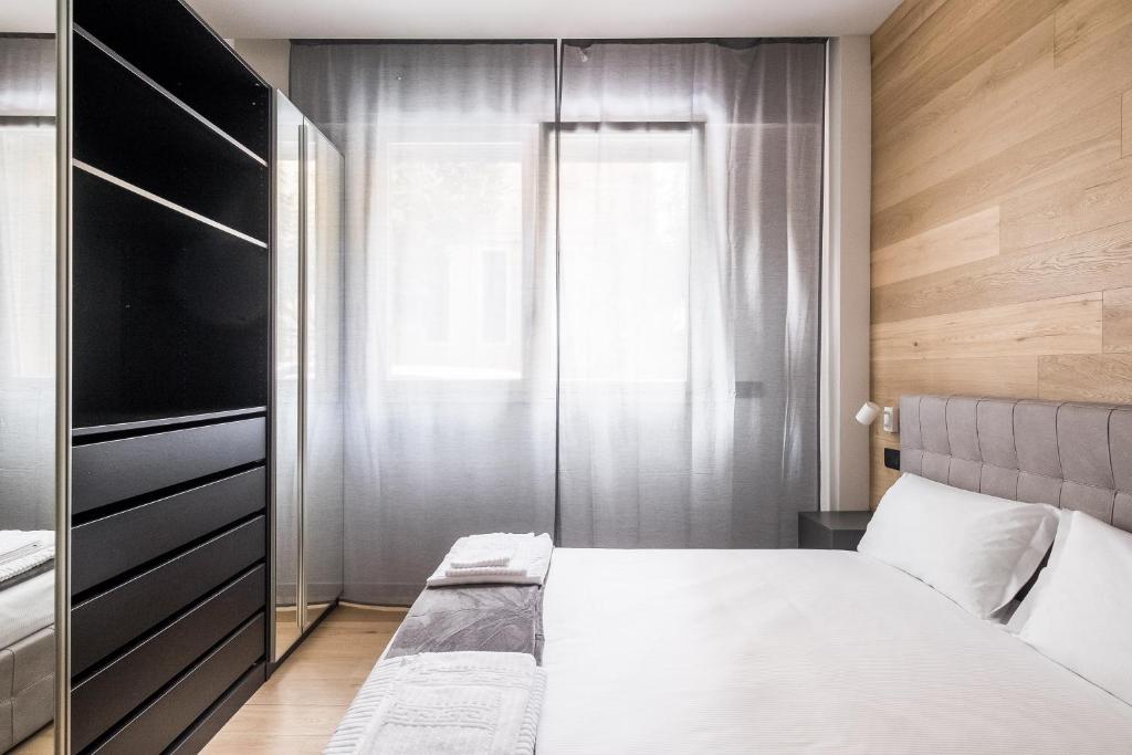 Posteľ alebo postele v izbe v ubytovaní Residence Sant'Orsola - Pizzardi Suites Apartments