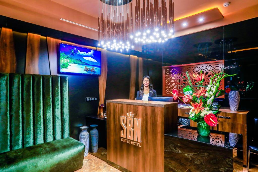 TV a/nebo společenská místnost v ubytování SBN Suite Hôtel