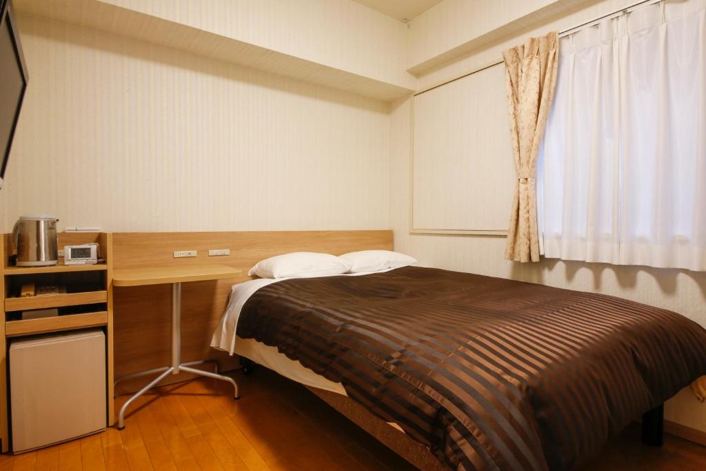 Postel nebo postele na pokoji v ubytování Hotel Sunlife