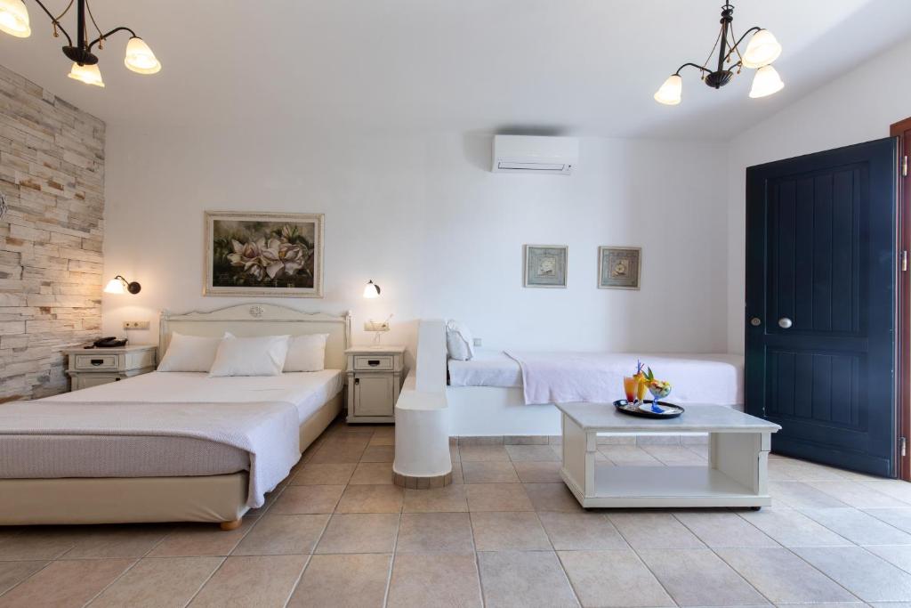Postel nebo postele na pokoji v ubytování Plaza Beach Hotel
