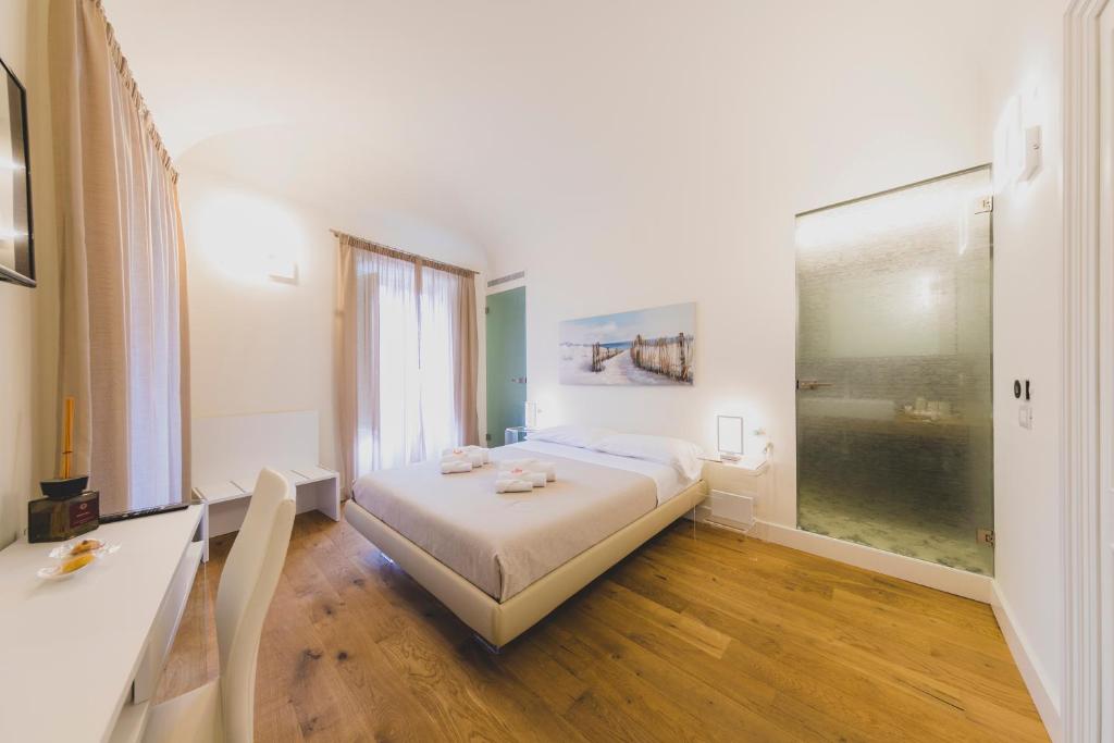 Łóżko lub łóżka w pokoju w obiekcie Cefalù Design Suites