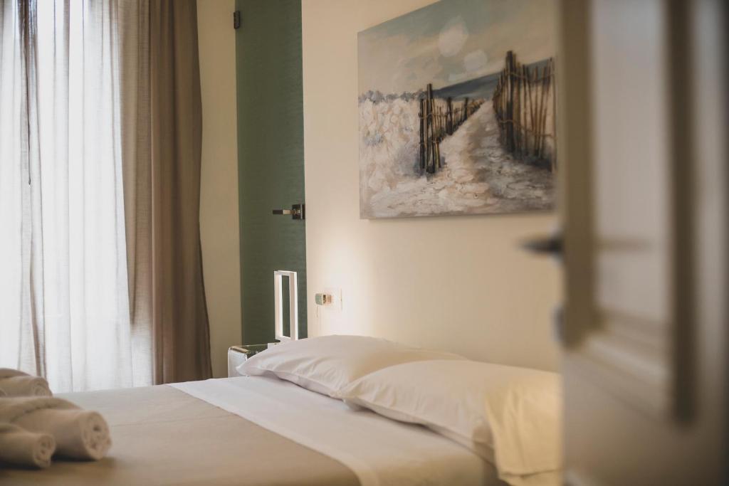 Łóżko lub łóżka w pokoju w obiekcie Cefalù Design Suites